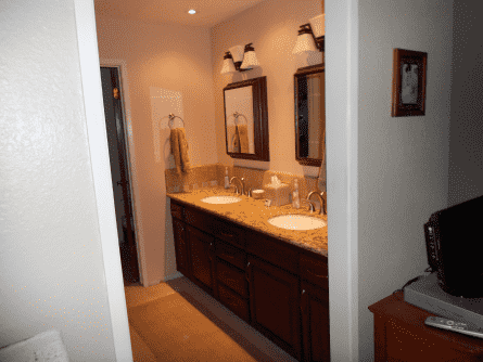 A bathroom with two sinks and two mirrors