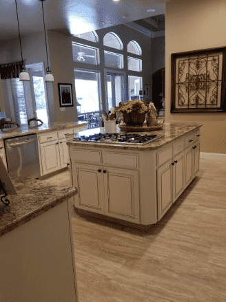 There is a large island in the middle of the kitchen.