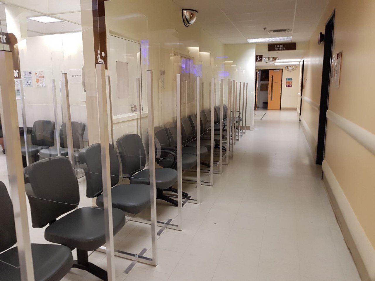 A row of chairs in a hospital waiting room
