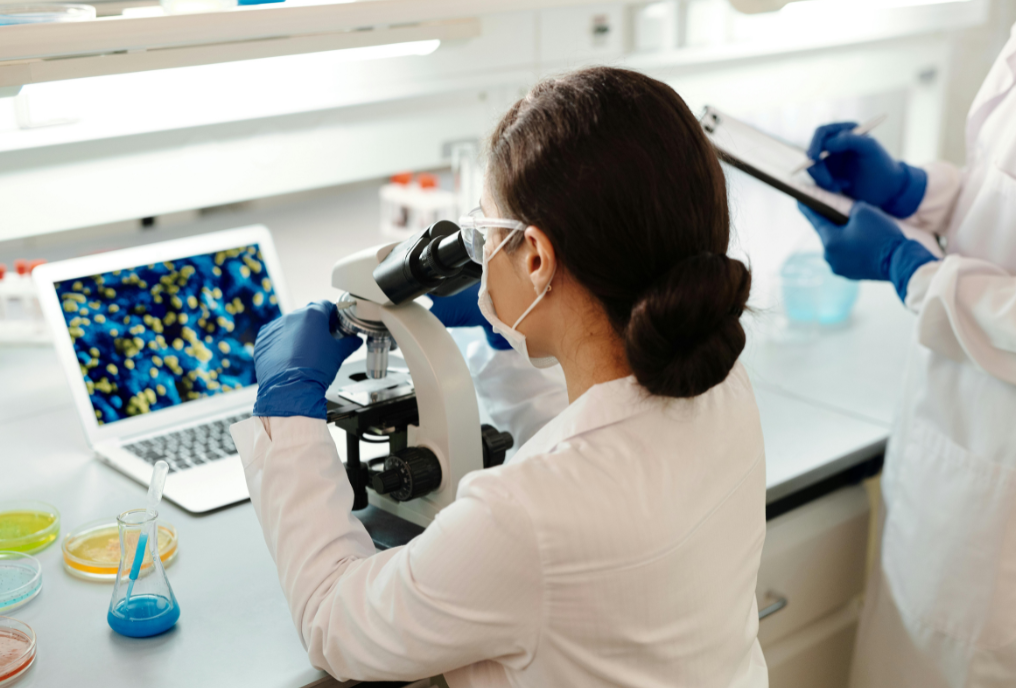 An image of a female scientist in a lab analyzing a mold sample as part of mold testing Boca Raton.
