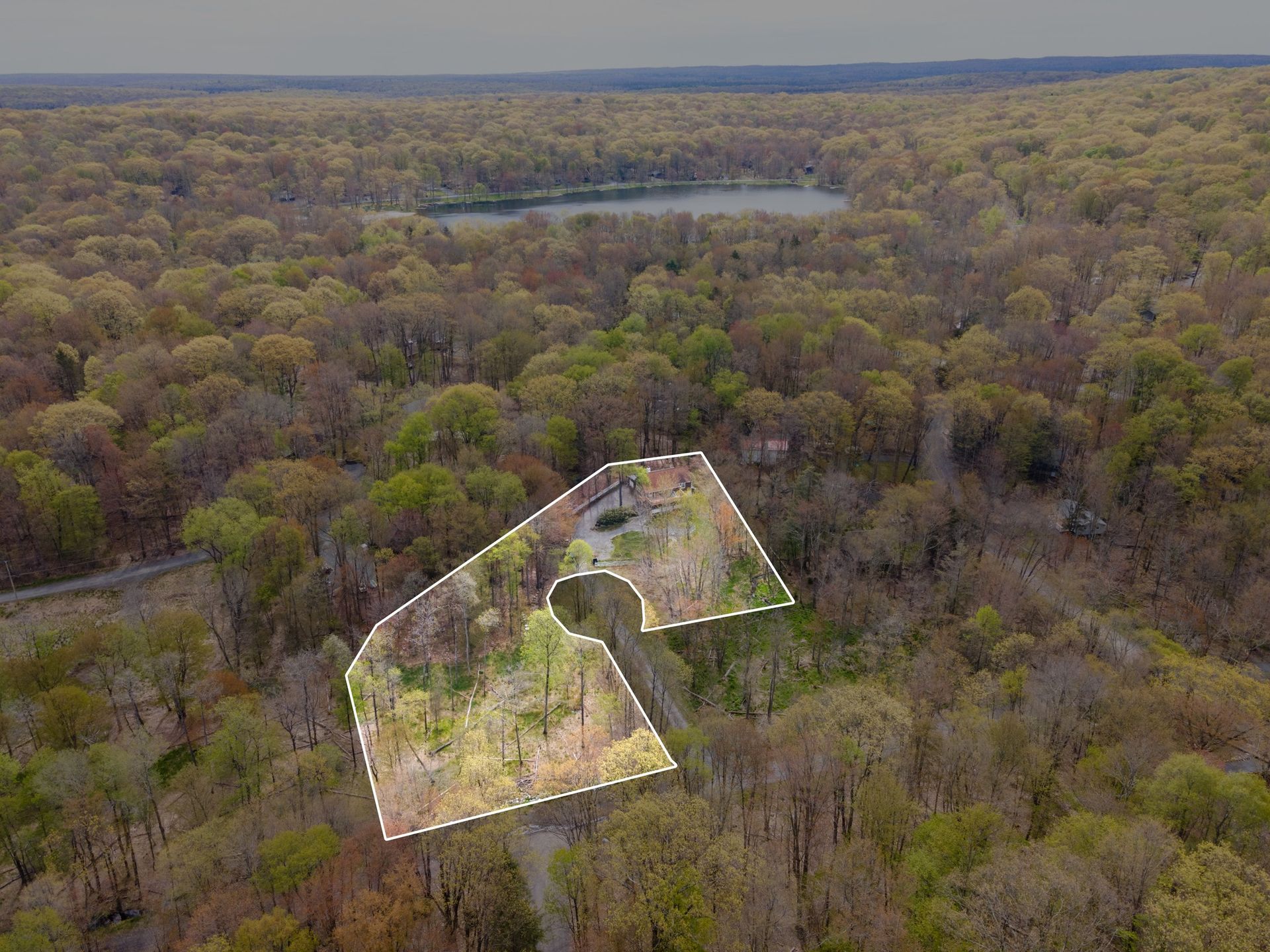 Aerial real estate photo in woods land parcel by Pocono Drone Photography