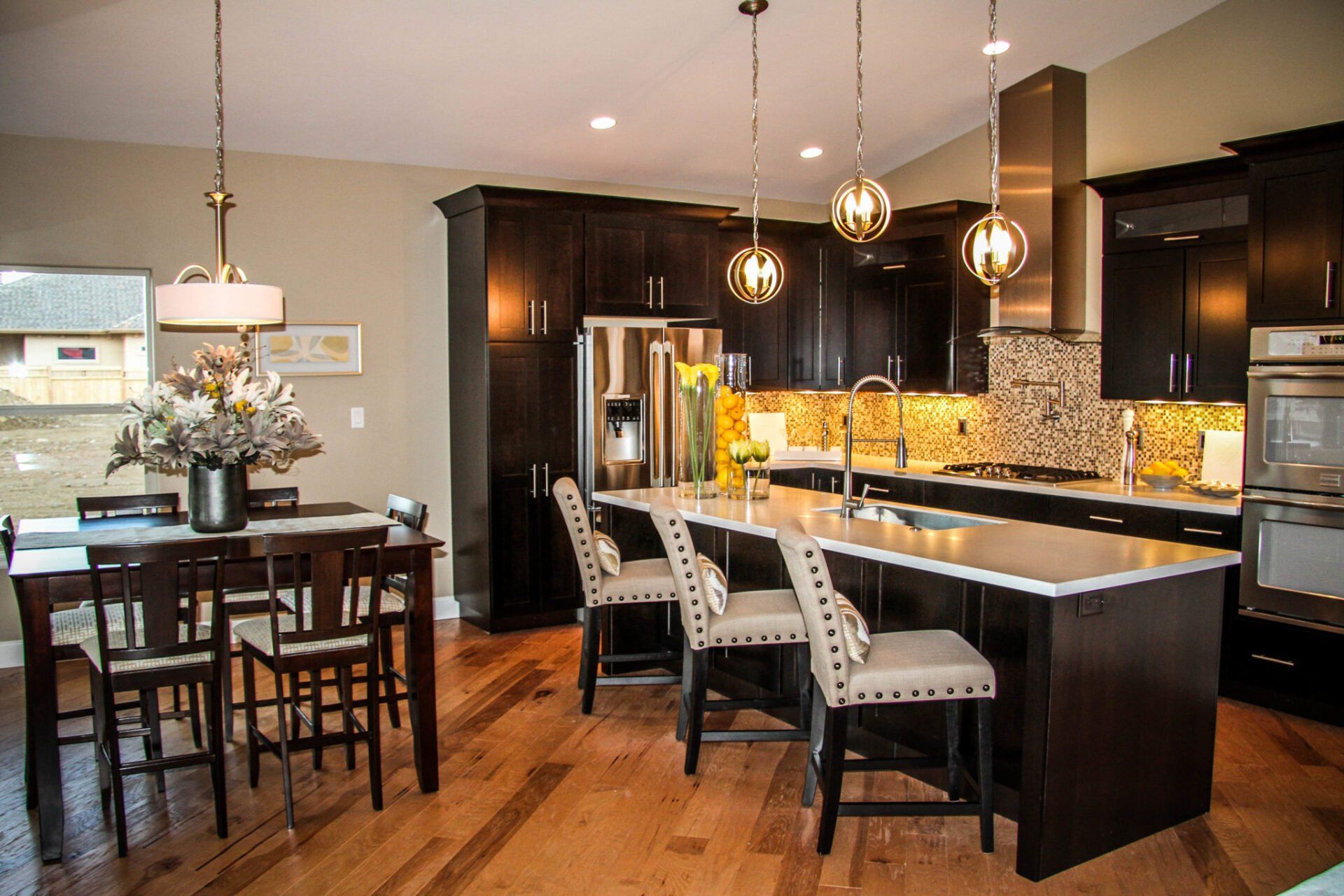Dining Room and Kitchen with Island | Integrity Homes | Grand Junction, CO 81501