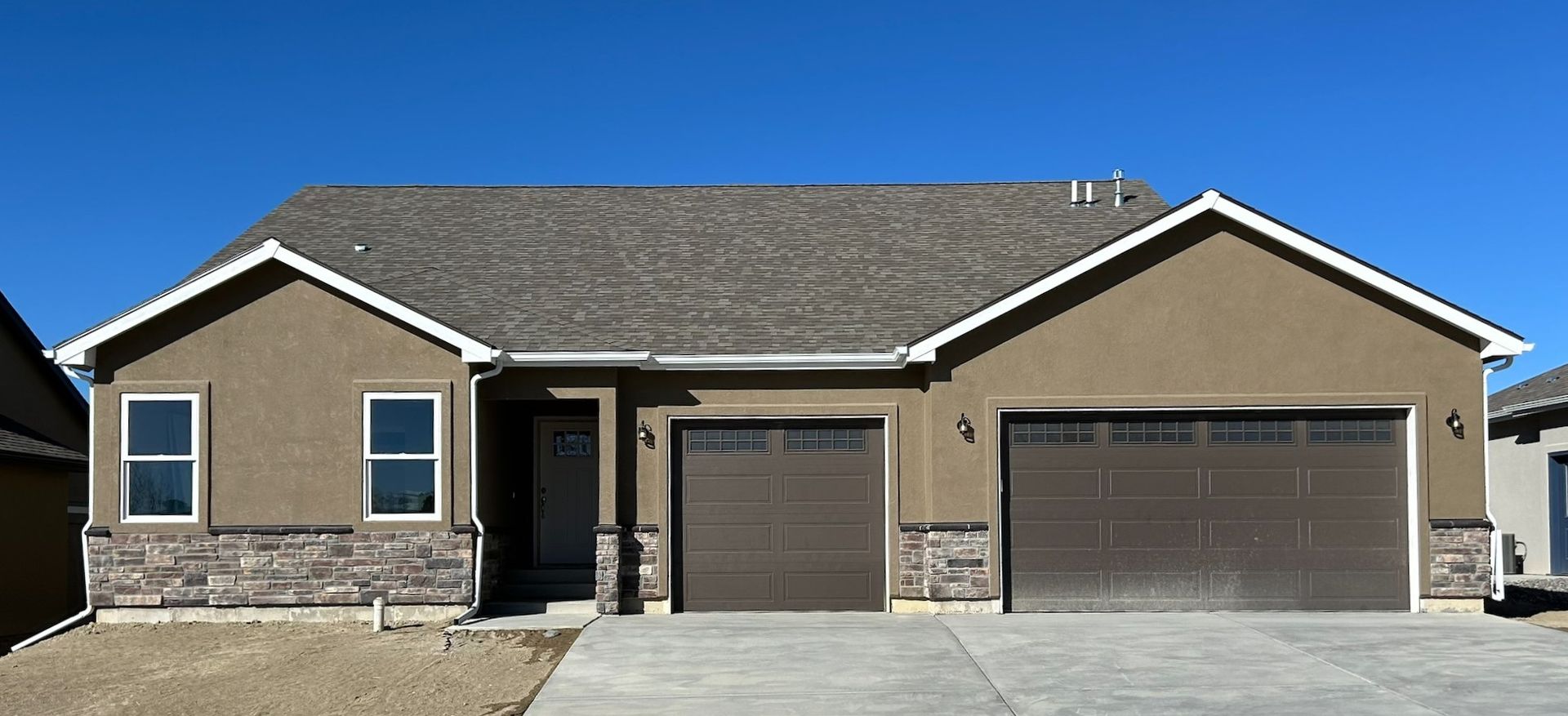 Big Pines craftsman brown stucco and stone front 