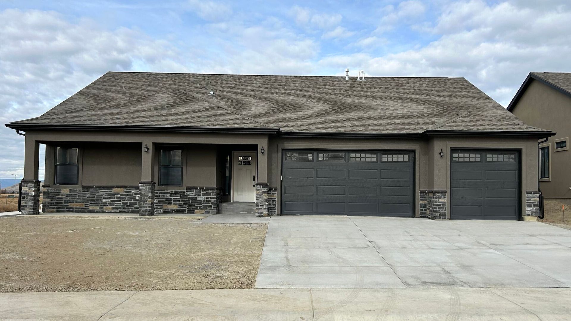 Big Pines craftsman brown stucco and stone front 