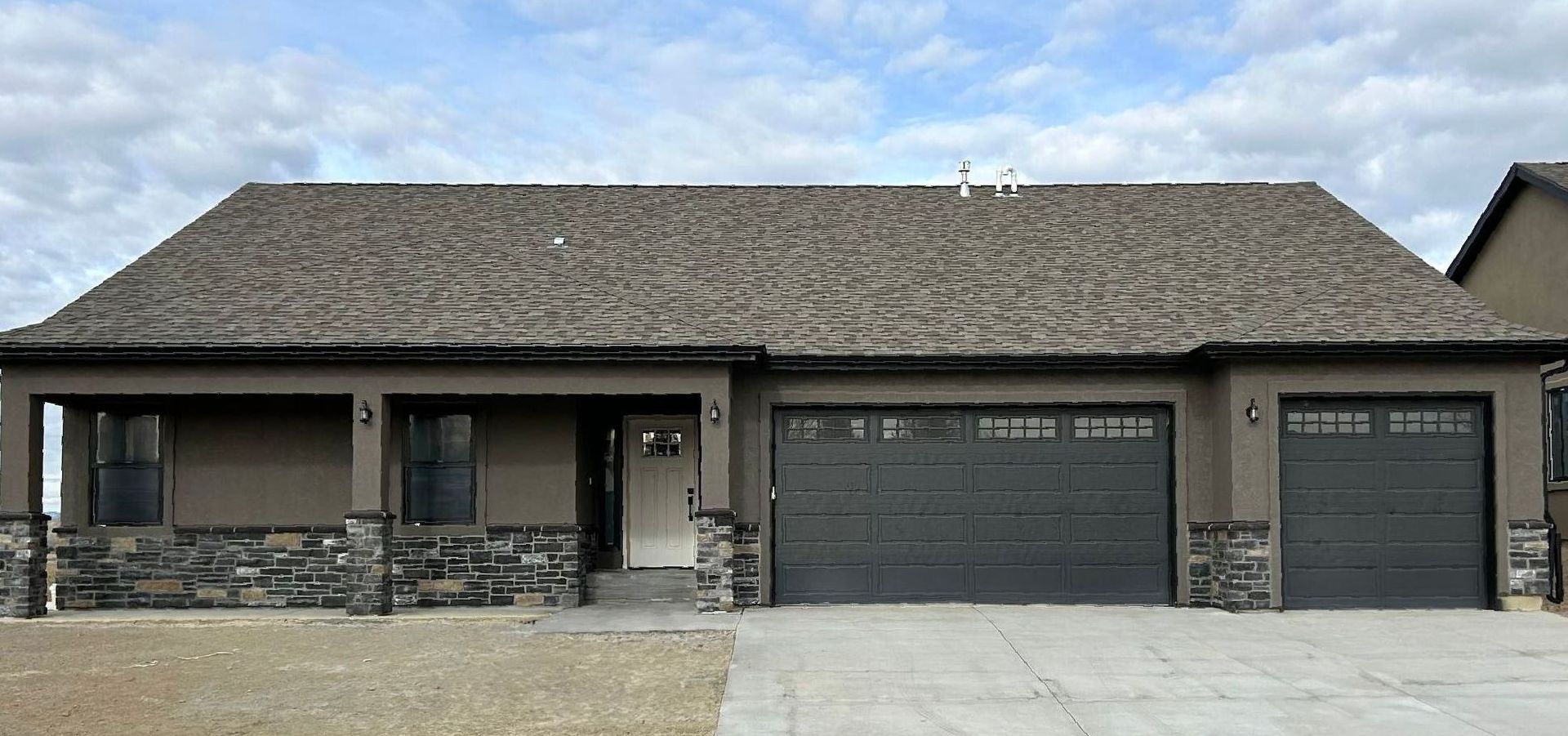 Craftsman stucco and stone front exterior photo