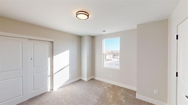 Secondary bedroom or office space in The Silverado model.