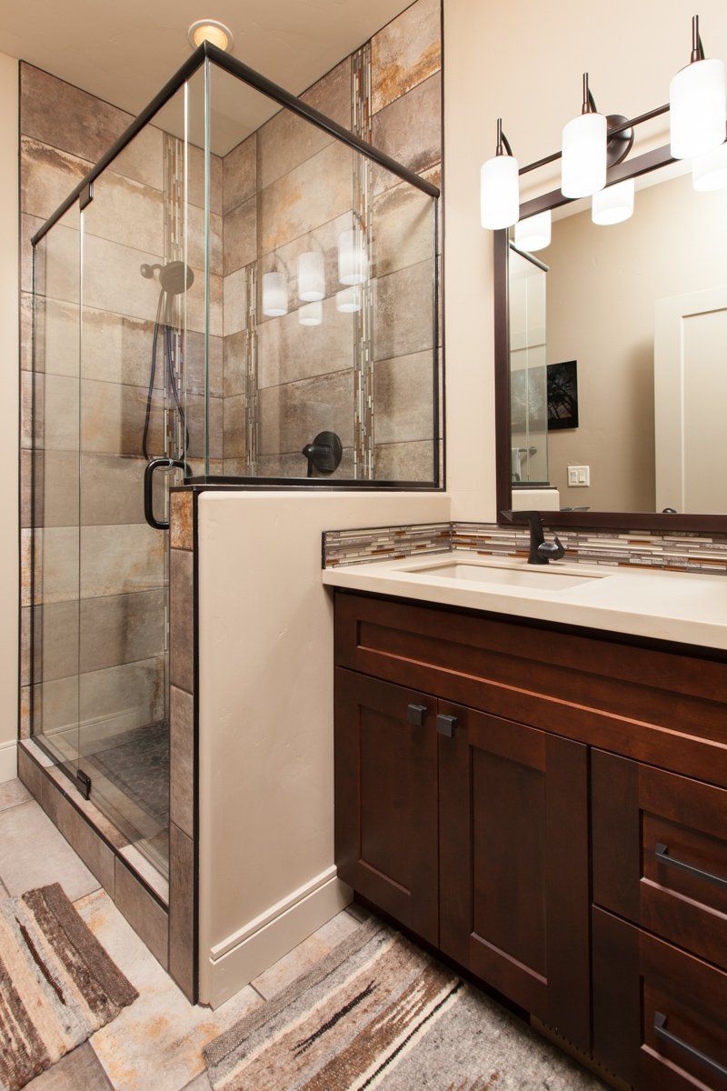 Tile Shower With Glass Door Next to Sink | Integrity Homes | Grand Junction, CO 81501