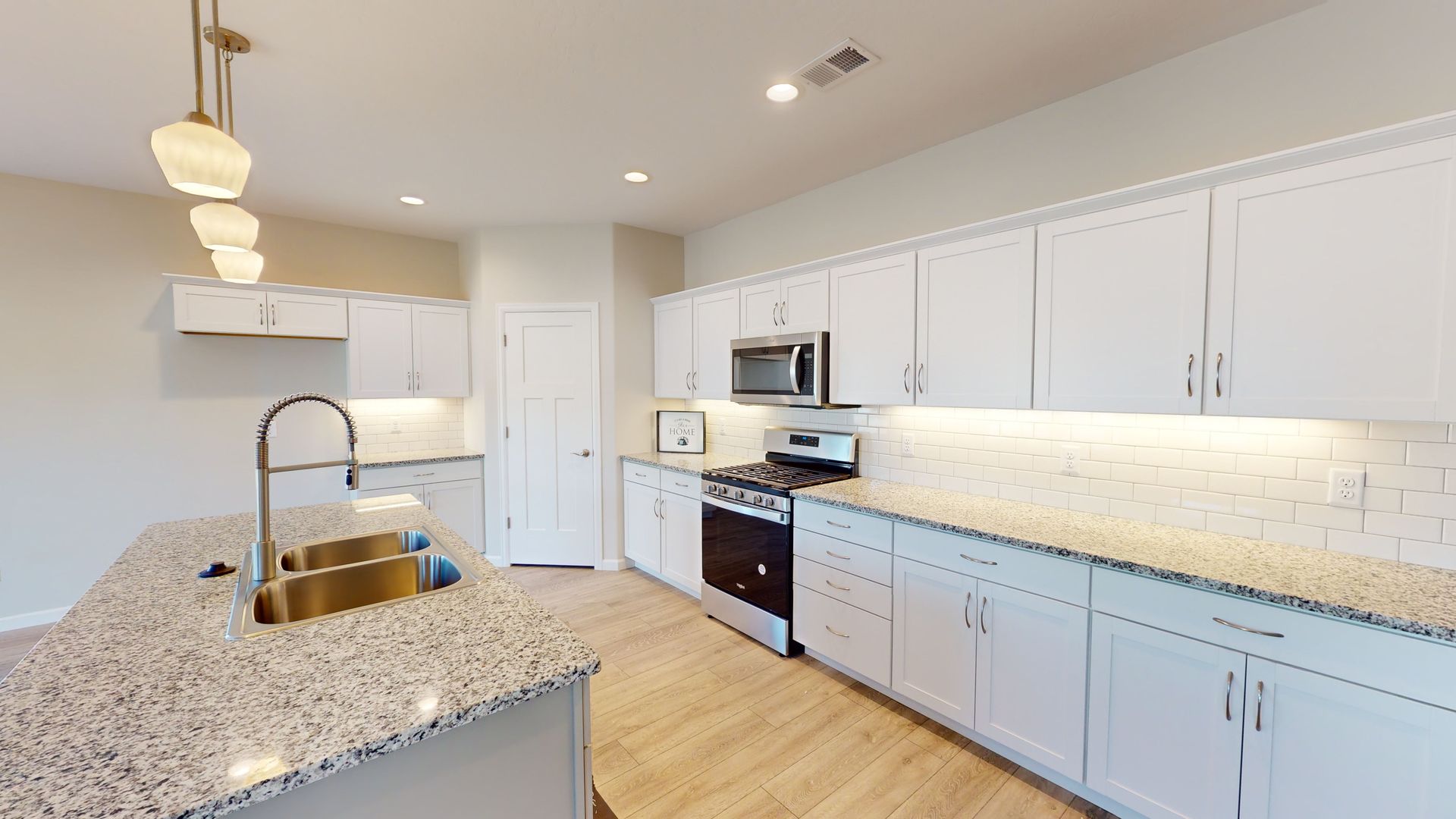 Bright white kitchen with granite counters