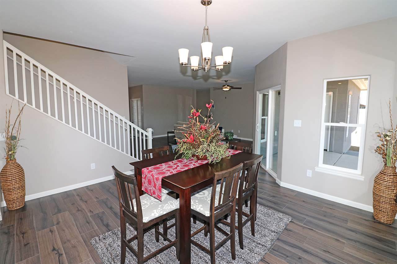 Dining Room with Large Window and Table for 6 | Integrity Homes | Grand Junction, CO 81501