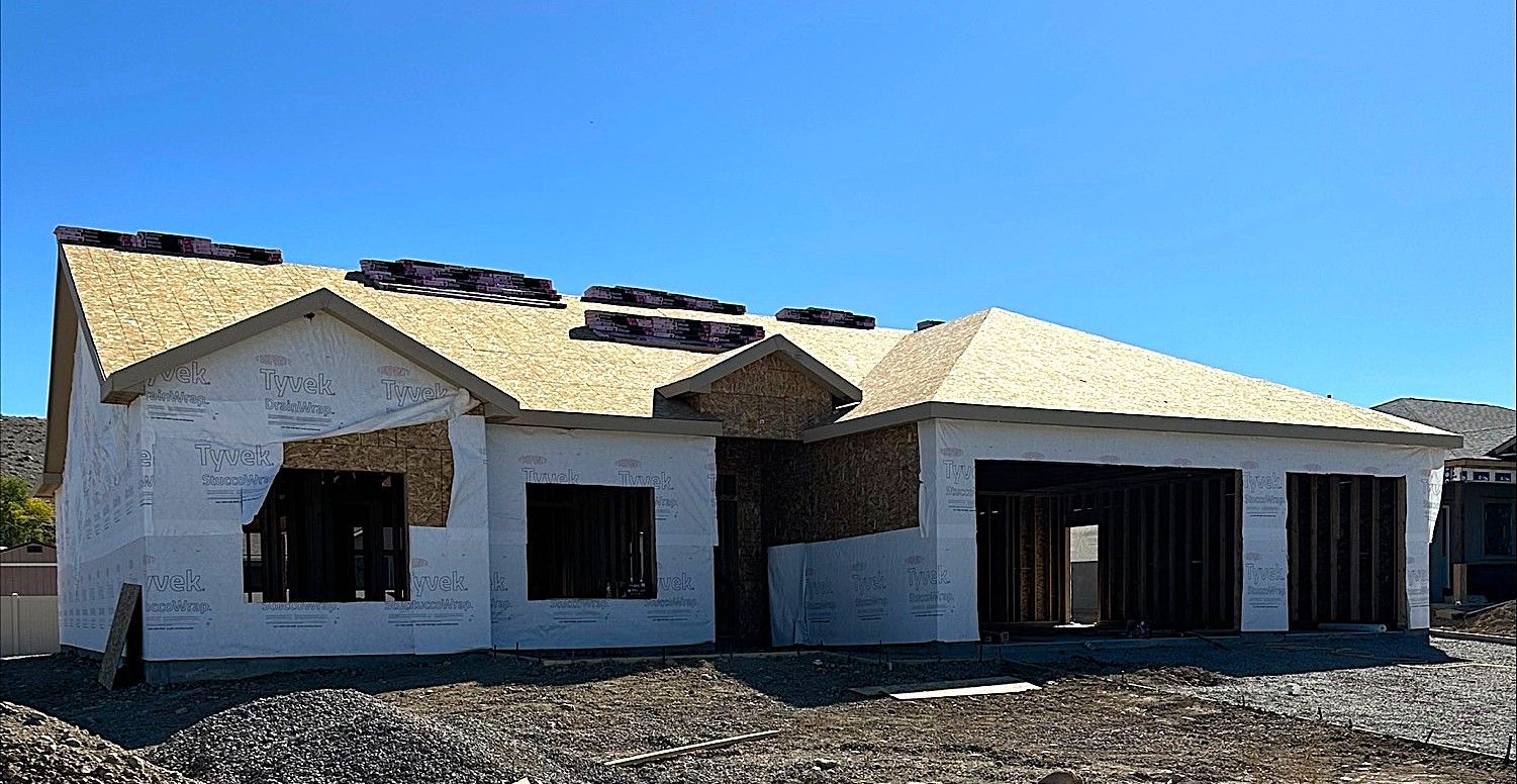 New home exterior for sale in Montrose, Colorado with a covered entryway.