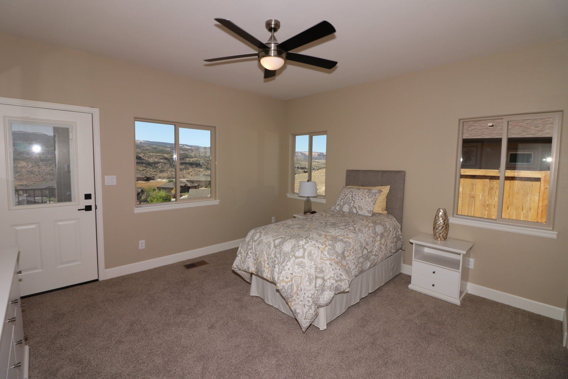 Bedroom with Ceiling Fan and Patio Access | Integrity Homes | Grand Junction, CO 81501