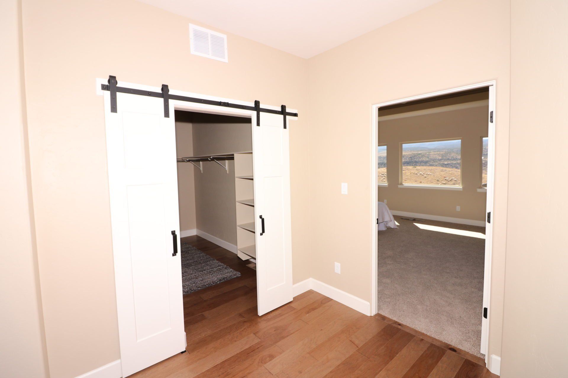 Walk-In Closet with French Barn Doors | Integrity Homes | Grand Junction, CO 81501