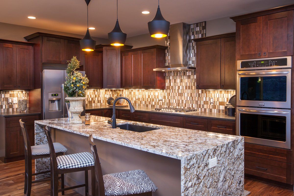 Kitchen with Marble Counters and Island | Integrity Homes | Grand Junction, CO 81501