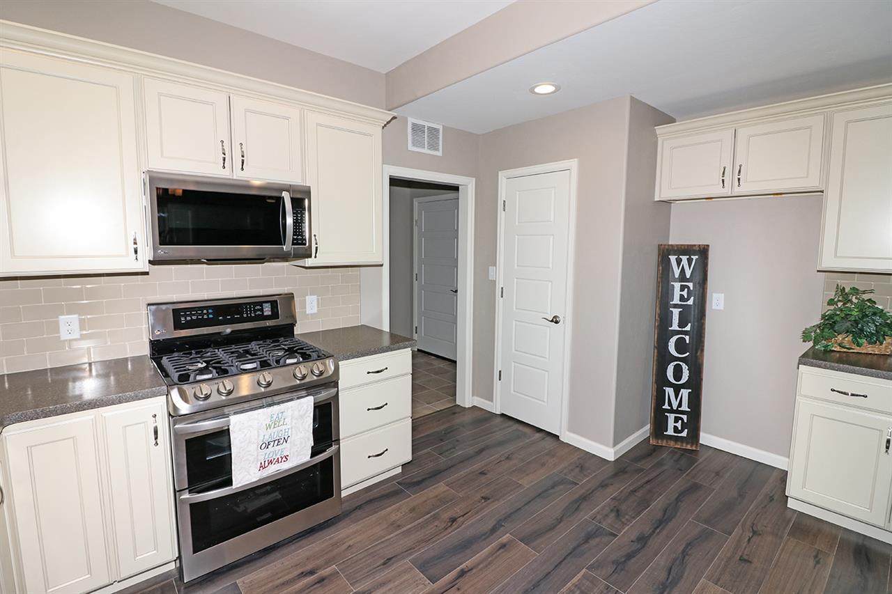 Kitchen with Stainless Steel Microwave and Range | Integrity Homes | Grand Junction, CO 81501