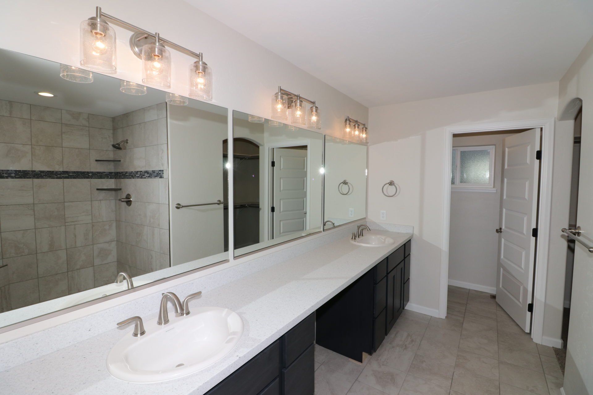 Primary Bathroom with Double Vanity and Walk-In Tile Shower | Integrity Homes | Grand Junction, CO 81501