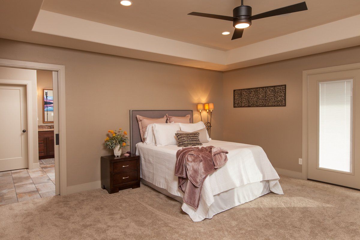 Primary Bedroom with Celling Fan and Recessed Ceiling | Integrity Homes | Grand Junction, CO 81501