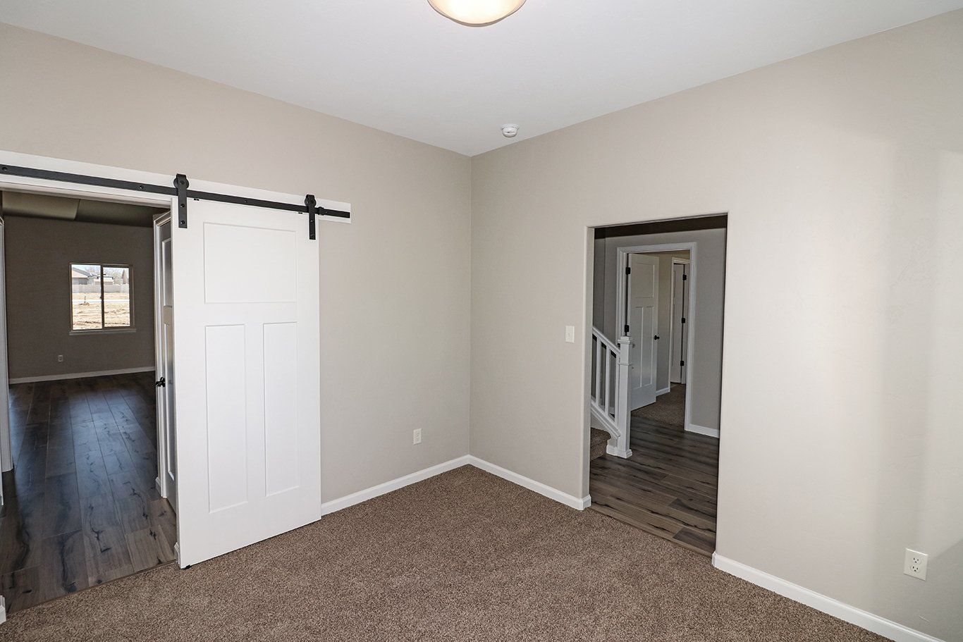 Flex Room with a sliding barndoor and second doorway | Integrity Homes | Grand Junction, CO 81501