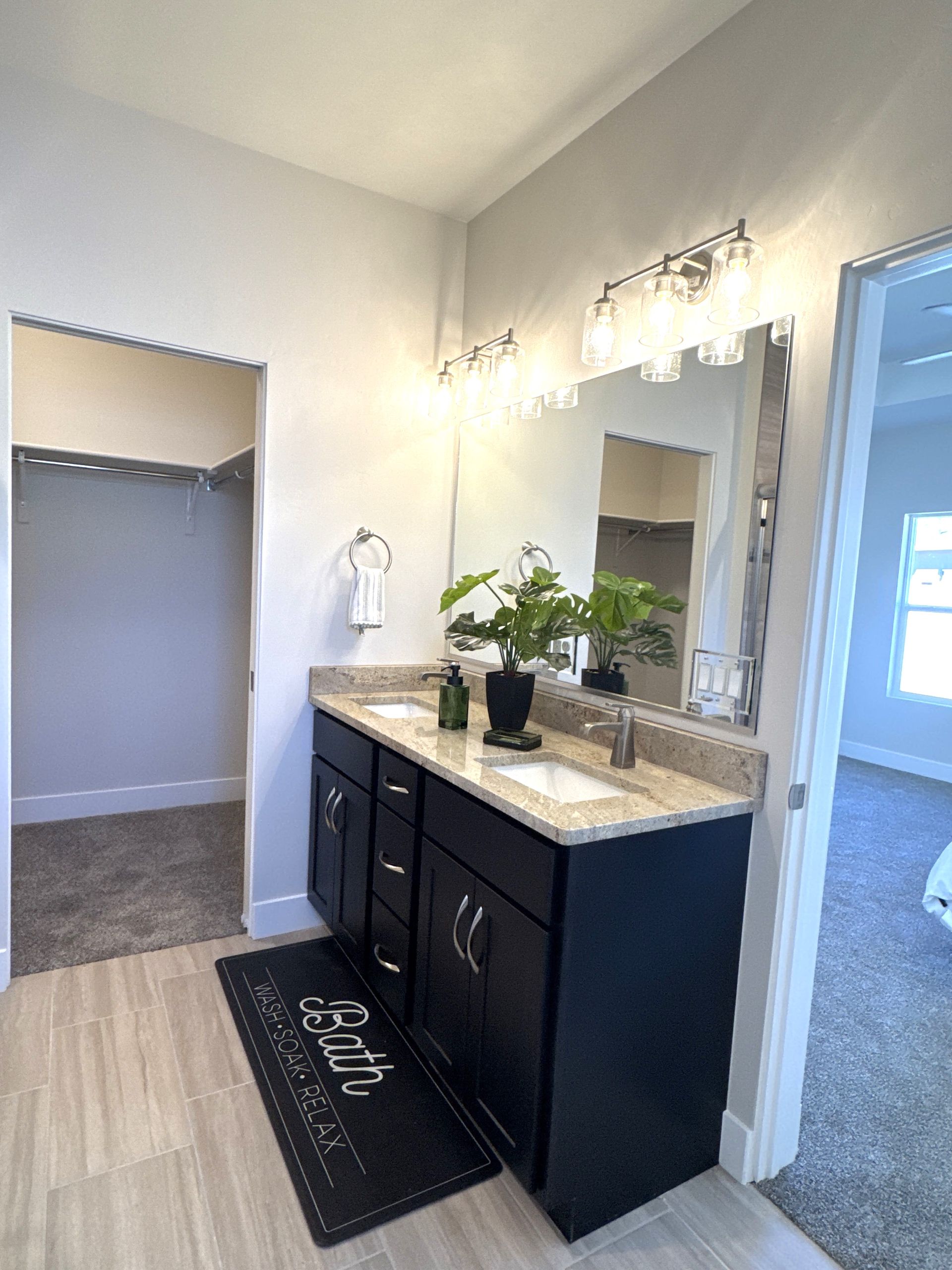 Dual vanity sinks in the primary bathroom at 3316 Pyrus St.