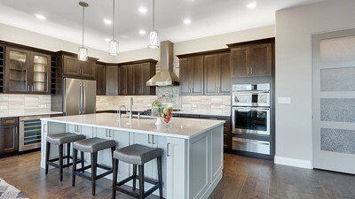 Gourmet kitchen interior with chef-inspired appliances and island seating