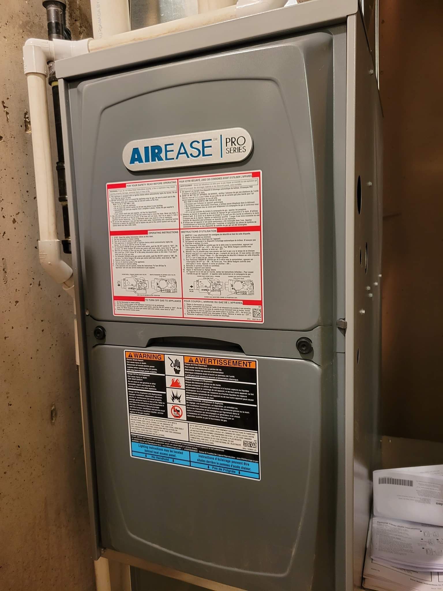 a gray air conditioner with a sticker on it .