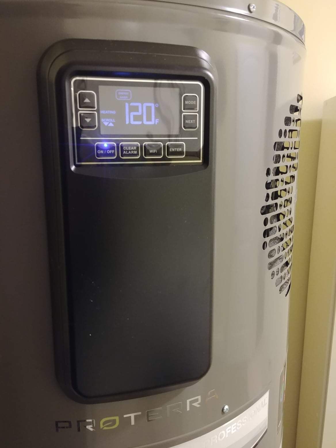 a close up of a water heater with a digital display on it .