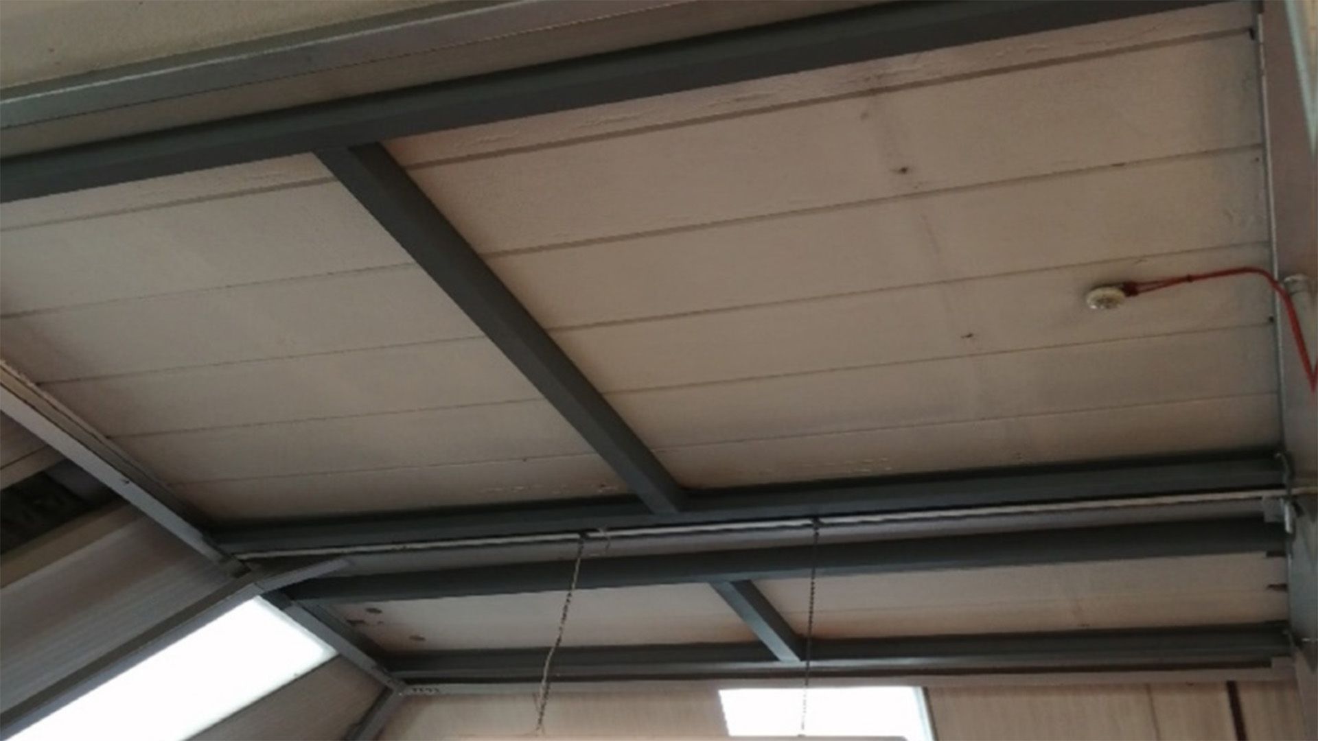 A RAAC ceiling of a building with a metal frame.