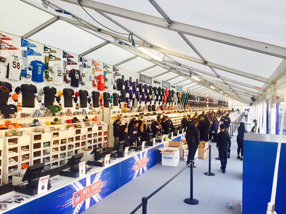 A large room with a lot of shirts on the wall