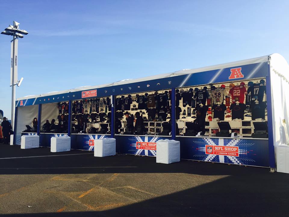 A blue and white tent with a british flag on it