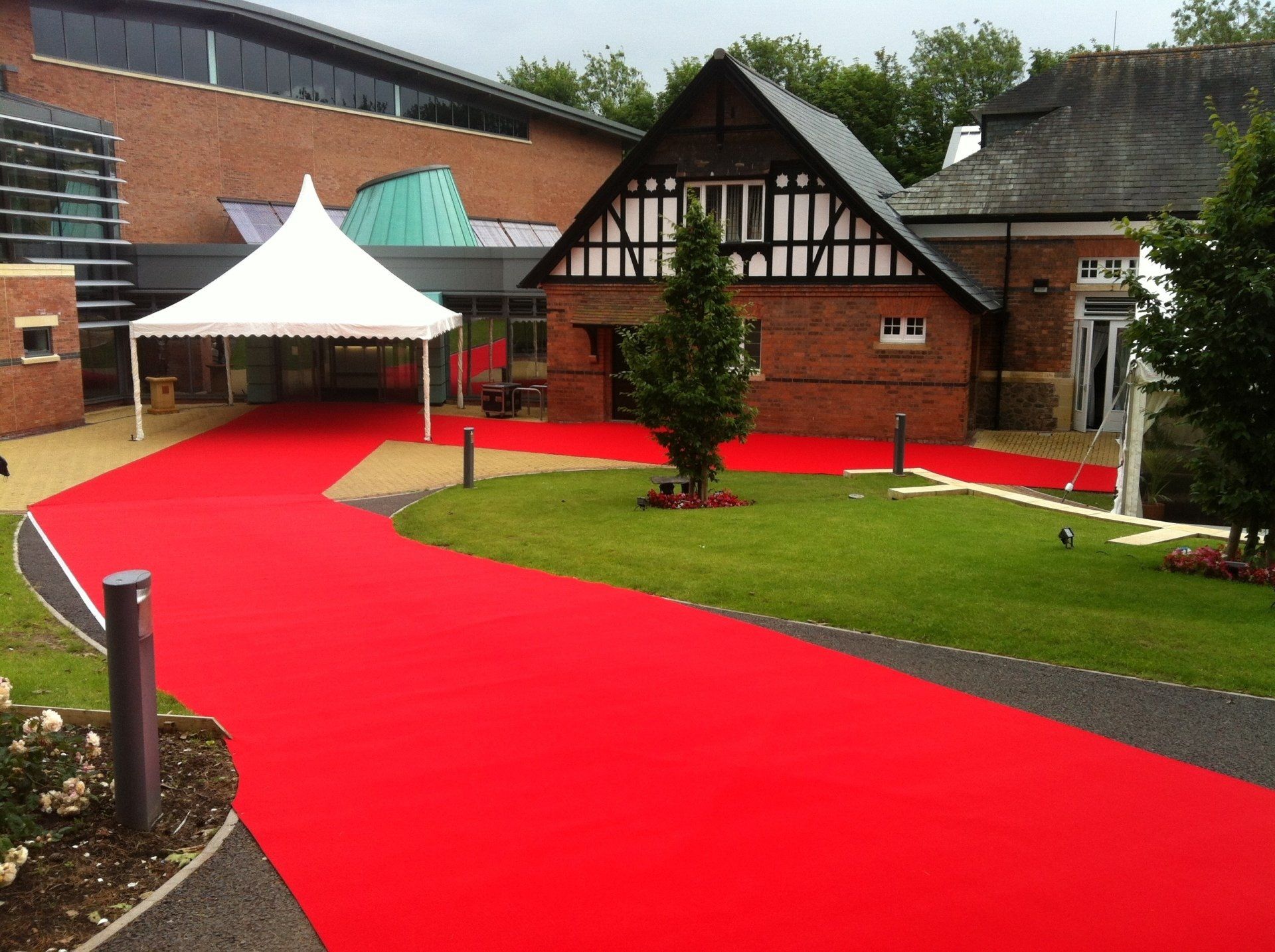 A large building with a red carpet in front of it