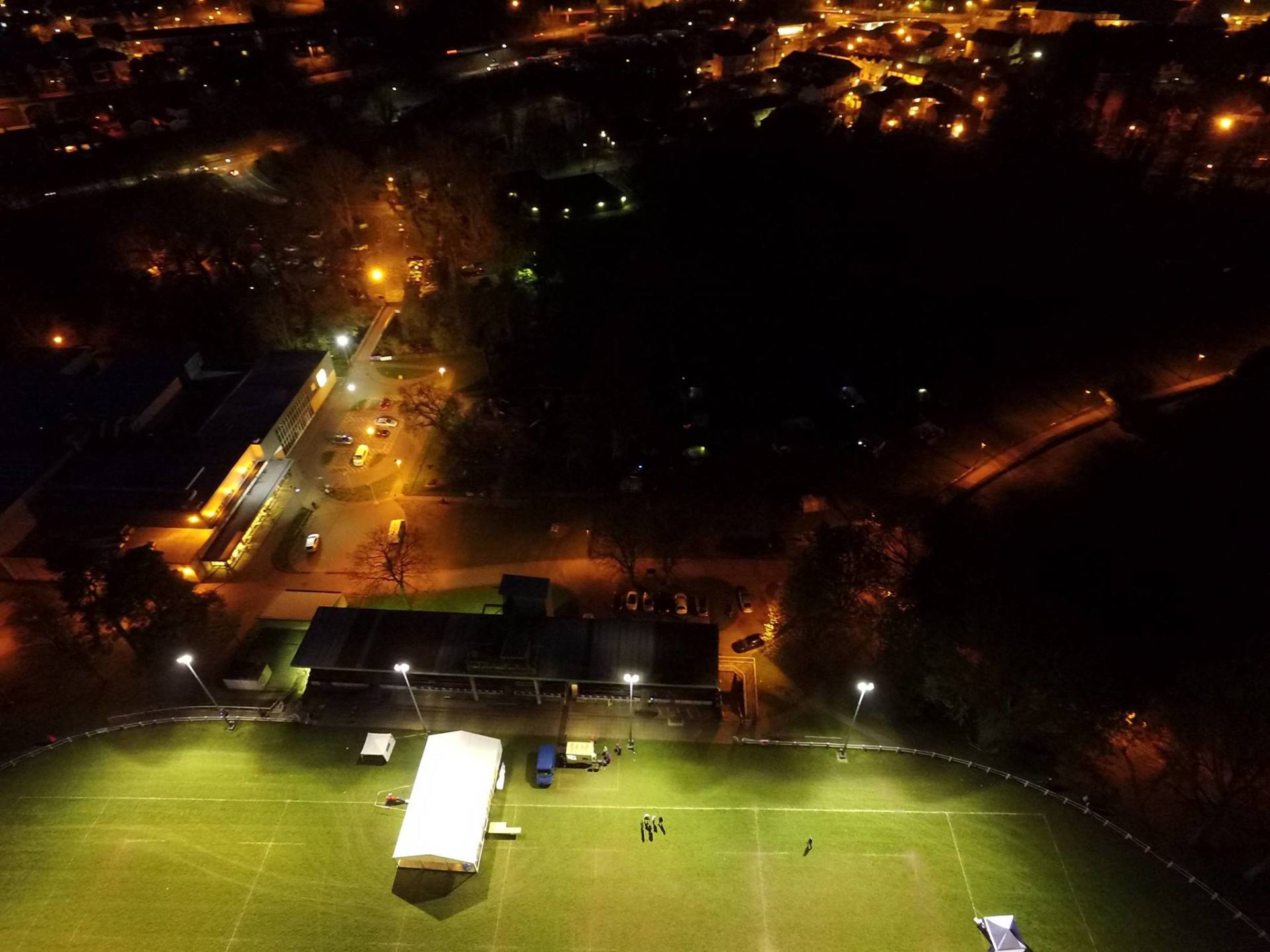 An aerial view of a soccer field at night.