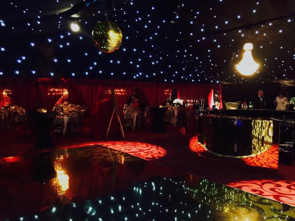 A large room with a disco ball hanging from the ceiling