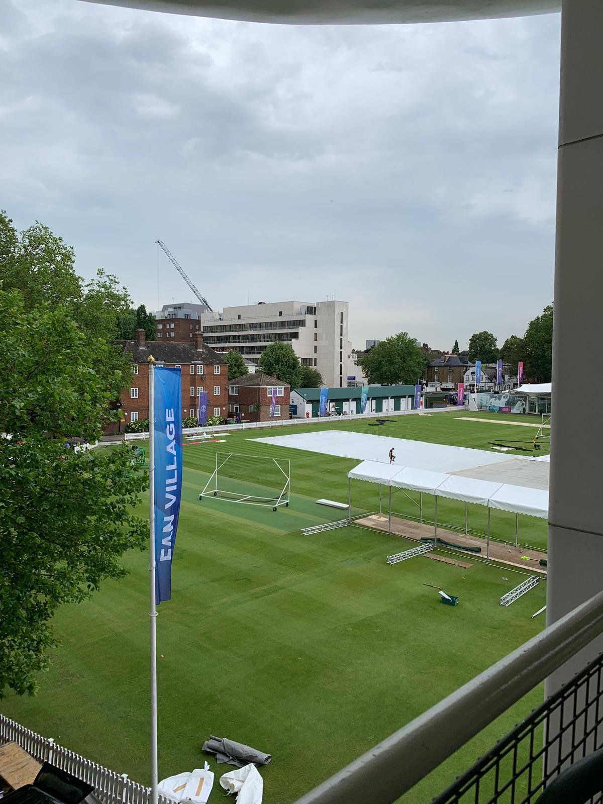 A view of a cricket field from a balcony
