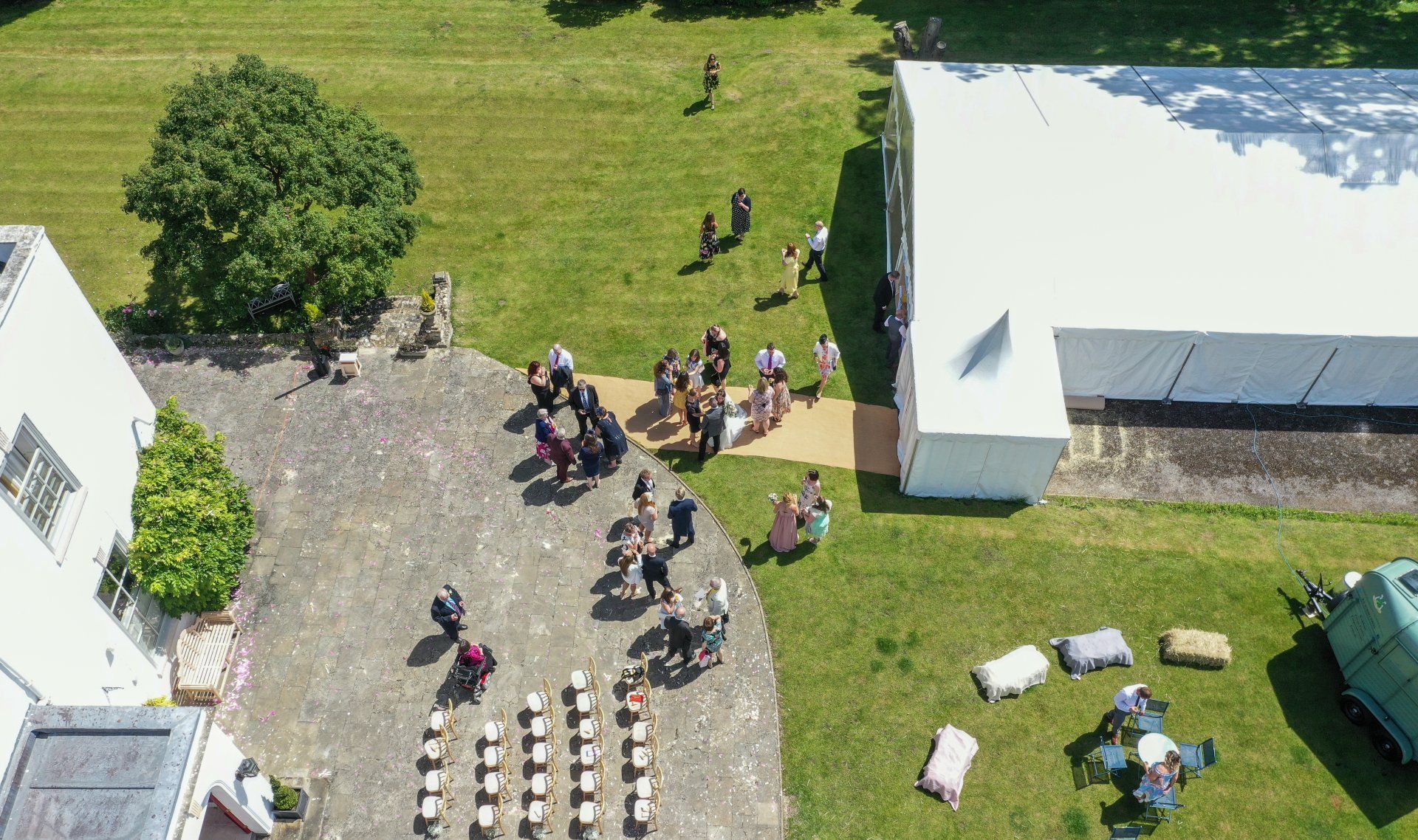An aerial view of a group of people standing in a field.