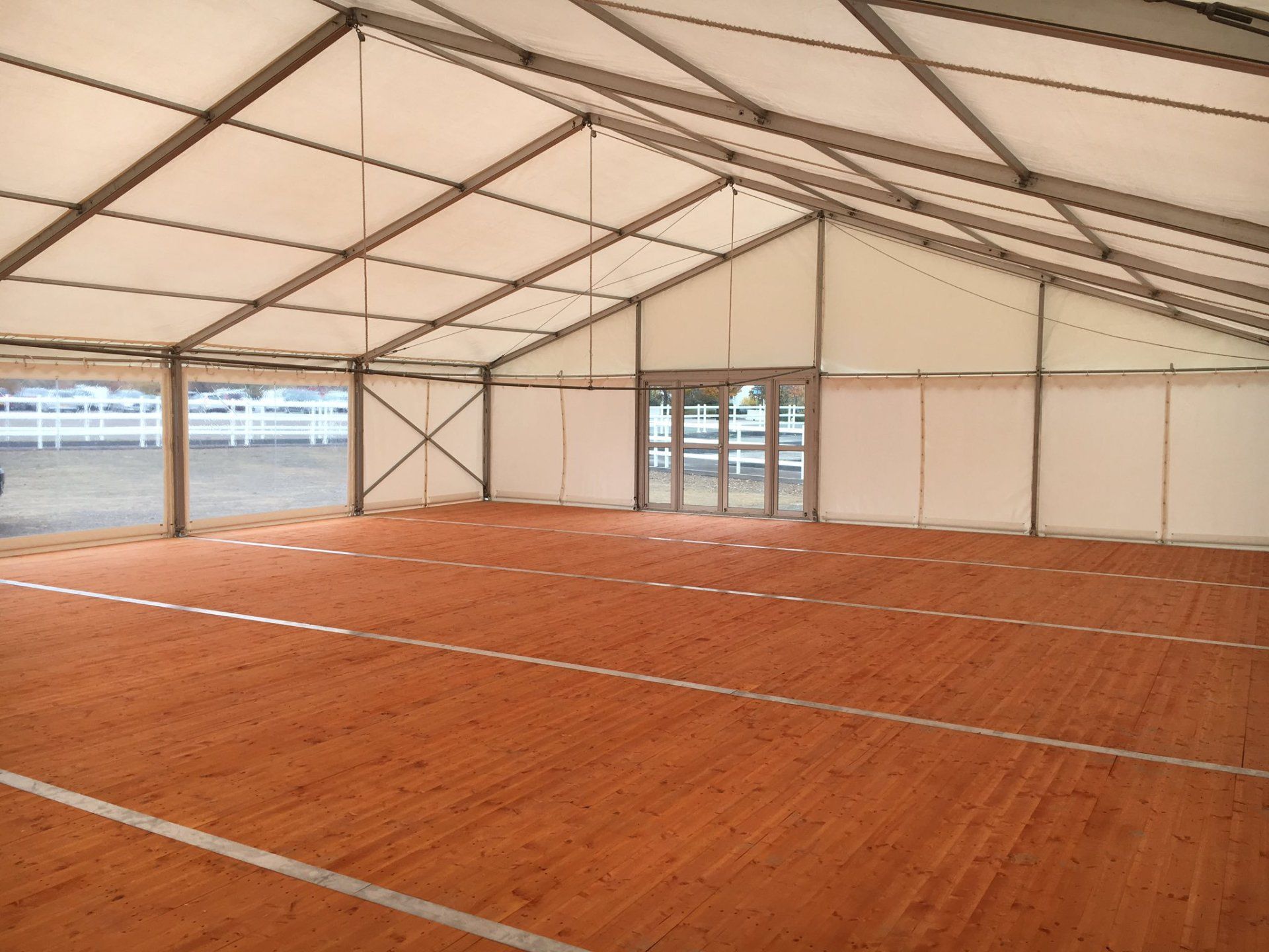 A large empty tent with a wooden floor