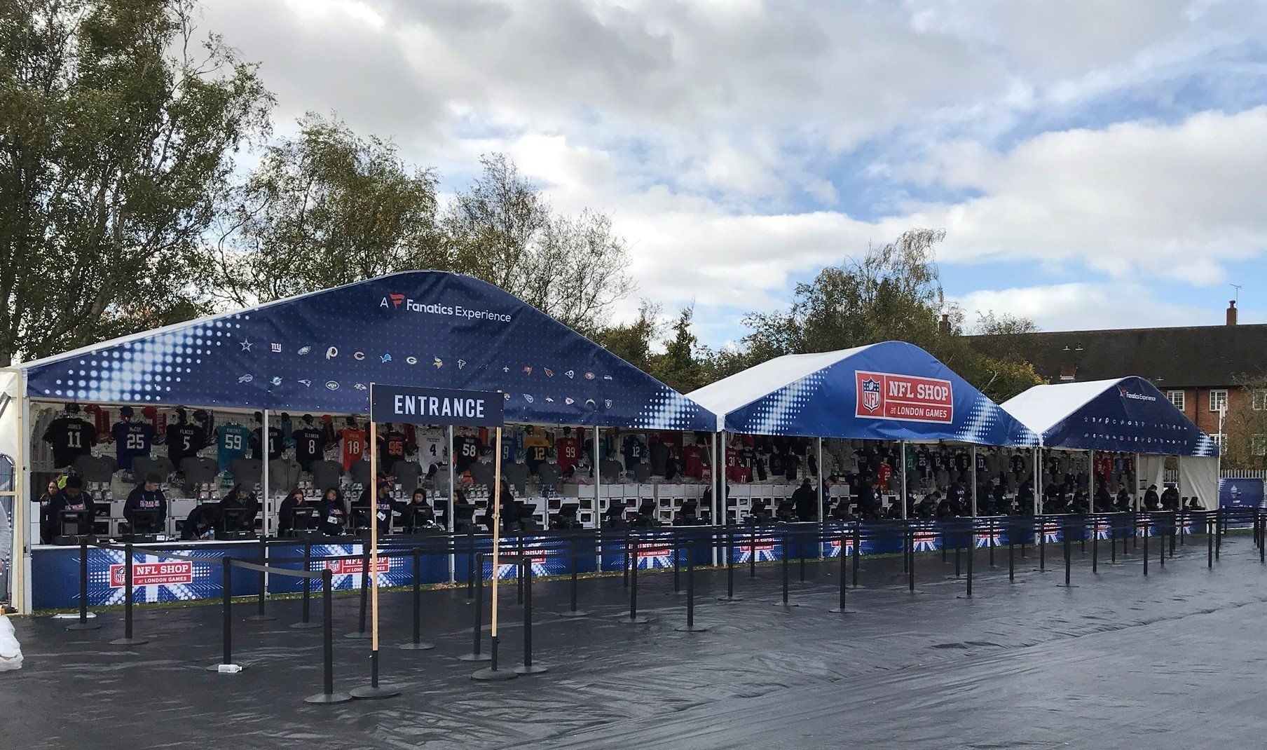 A row of blue tents with british flags on them