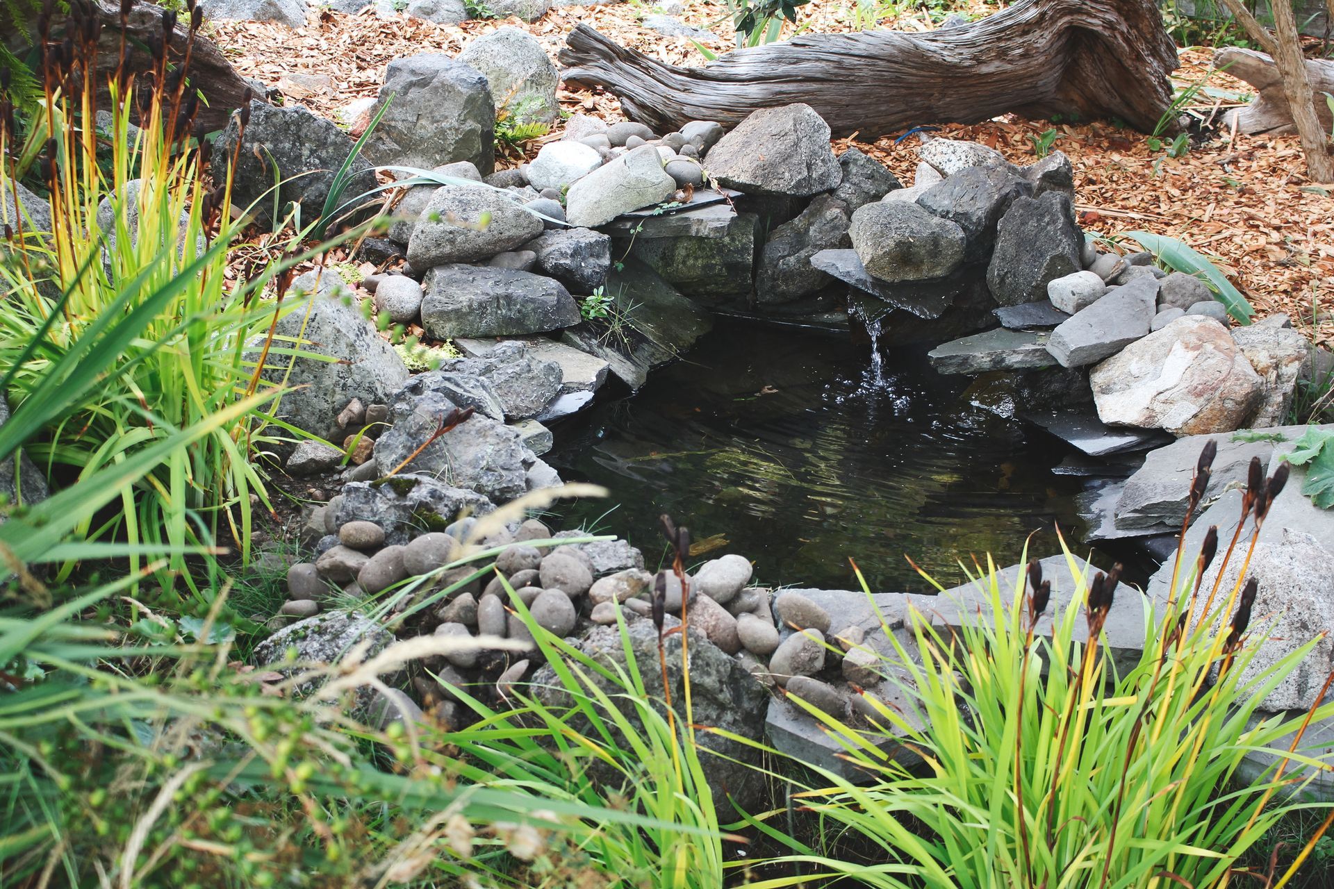Yard waterfall in a pond. Yard waterfall in a pond.