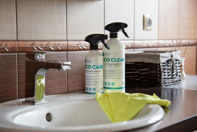 Two cleaning spray bottles labeled 