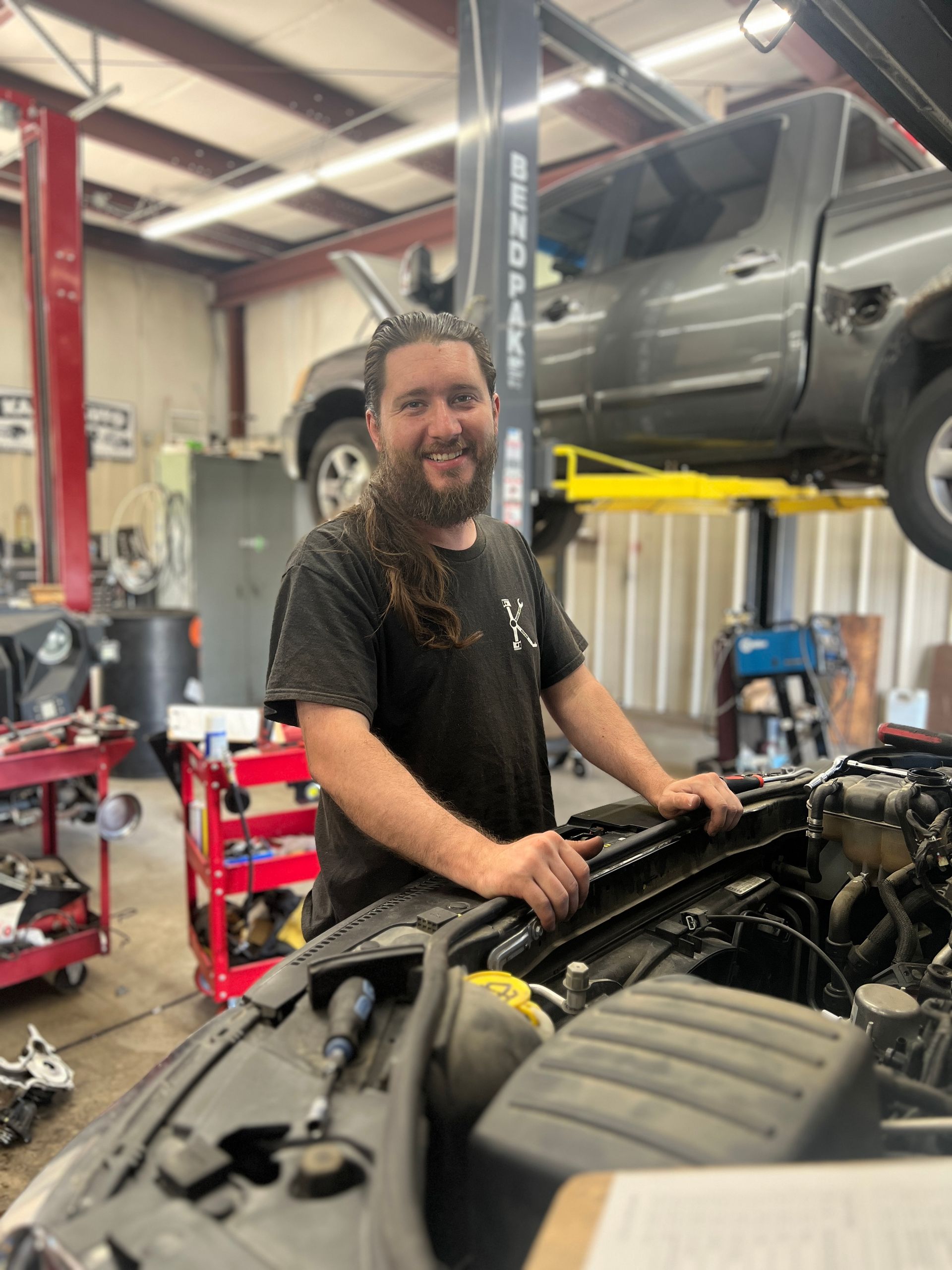 Mechanic Fixing Chevy Engine | KAAMS Auto Repair