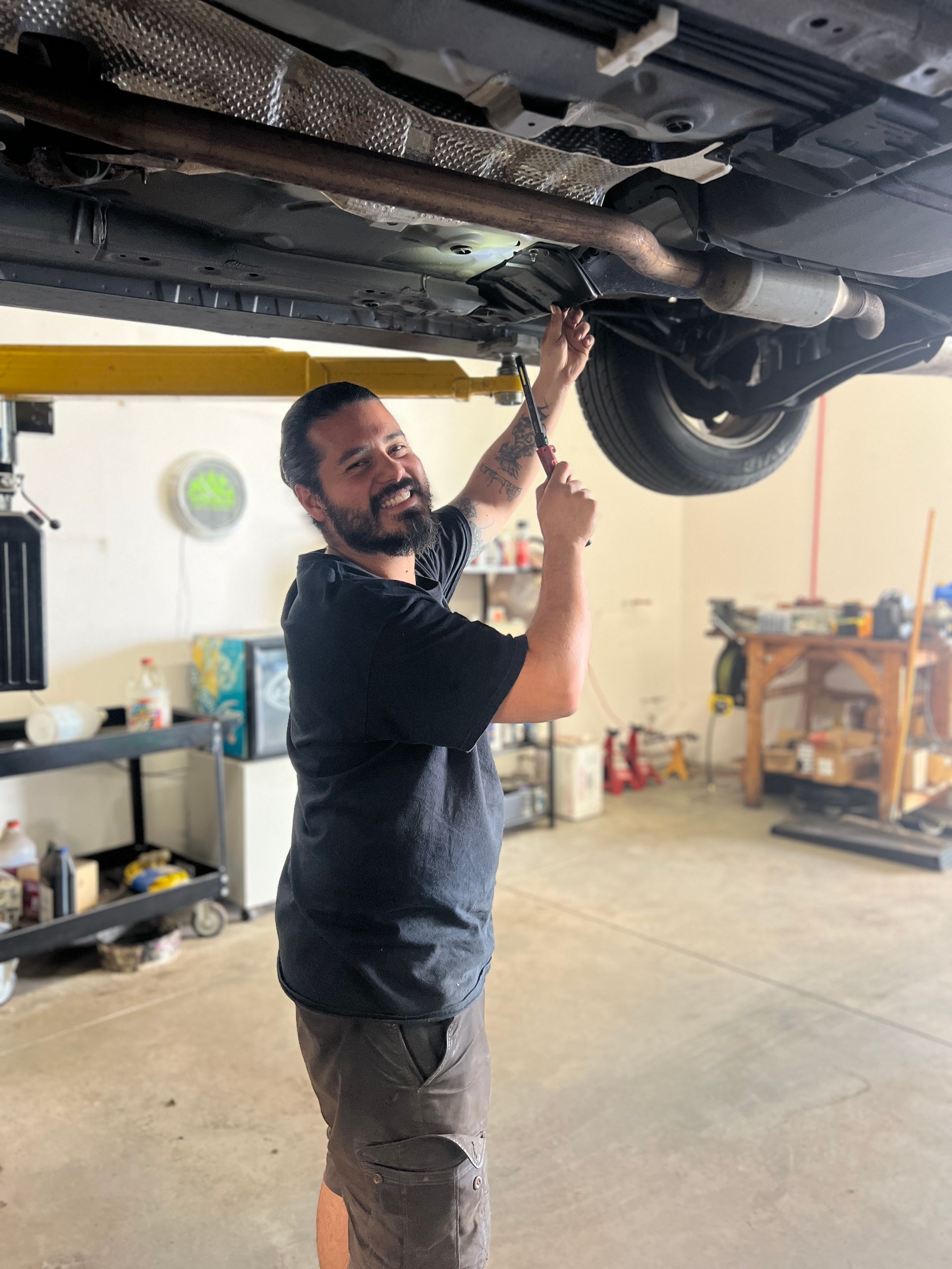 Red 2 Door Coupe In-front of Shop | KAAMS Auto Repair