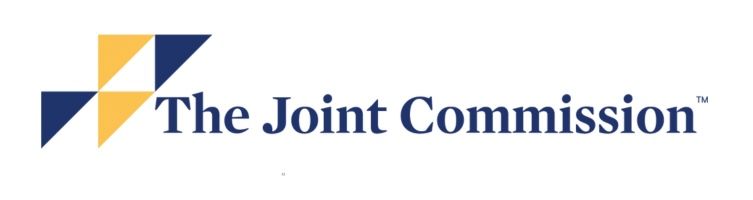 A blue and yellow logo for the joint commission