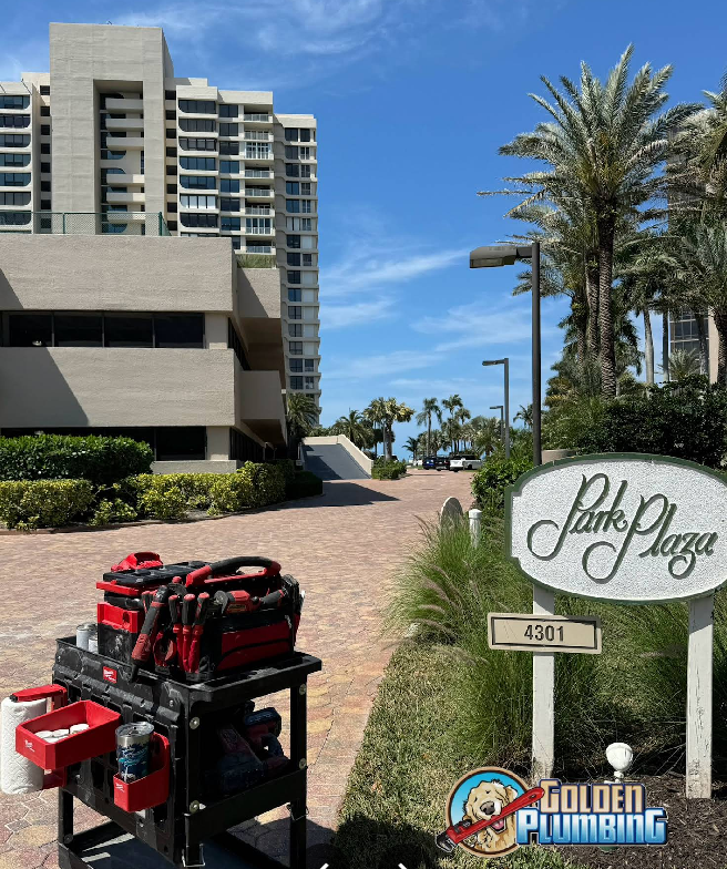 A plumber 's cart is parked in front of a building.