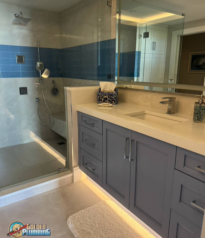 A bathroom with a sink a mirror and a shower