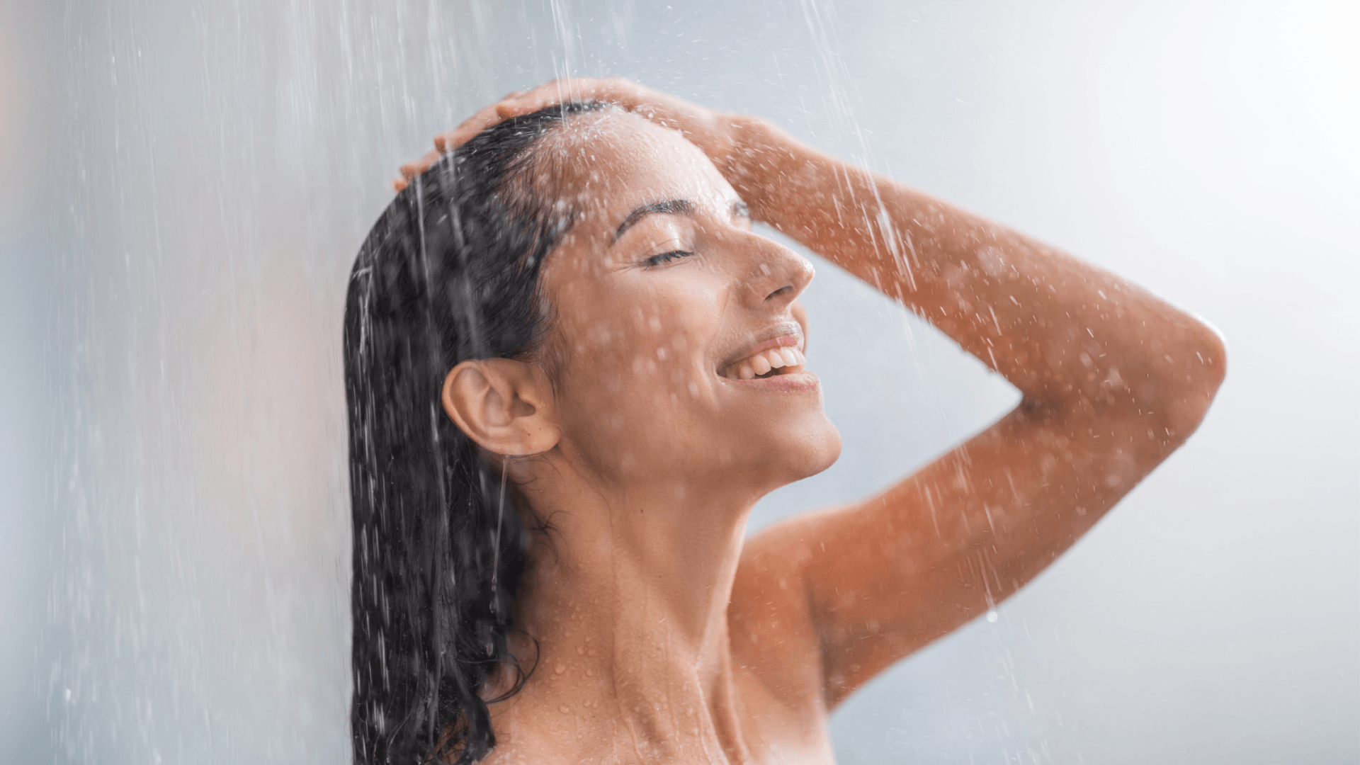 Woman showering with a great working Hot Water System