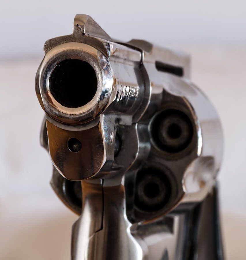Close up of gun points to a Toronto criminal defence lawyer to fight firearm offence charges.