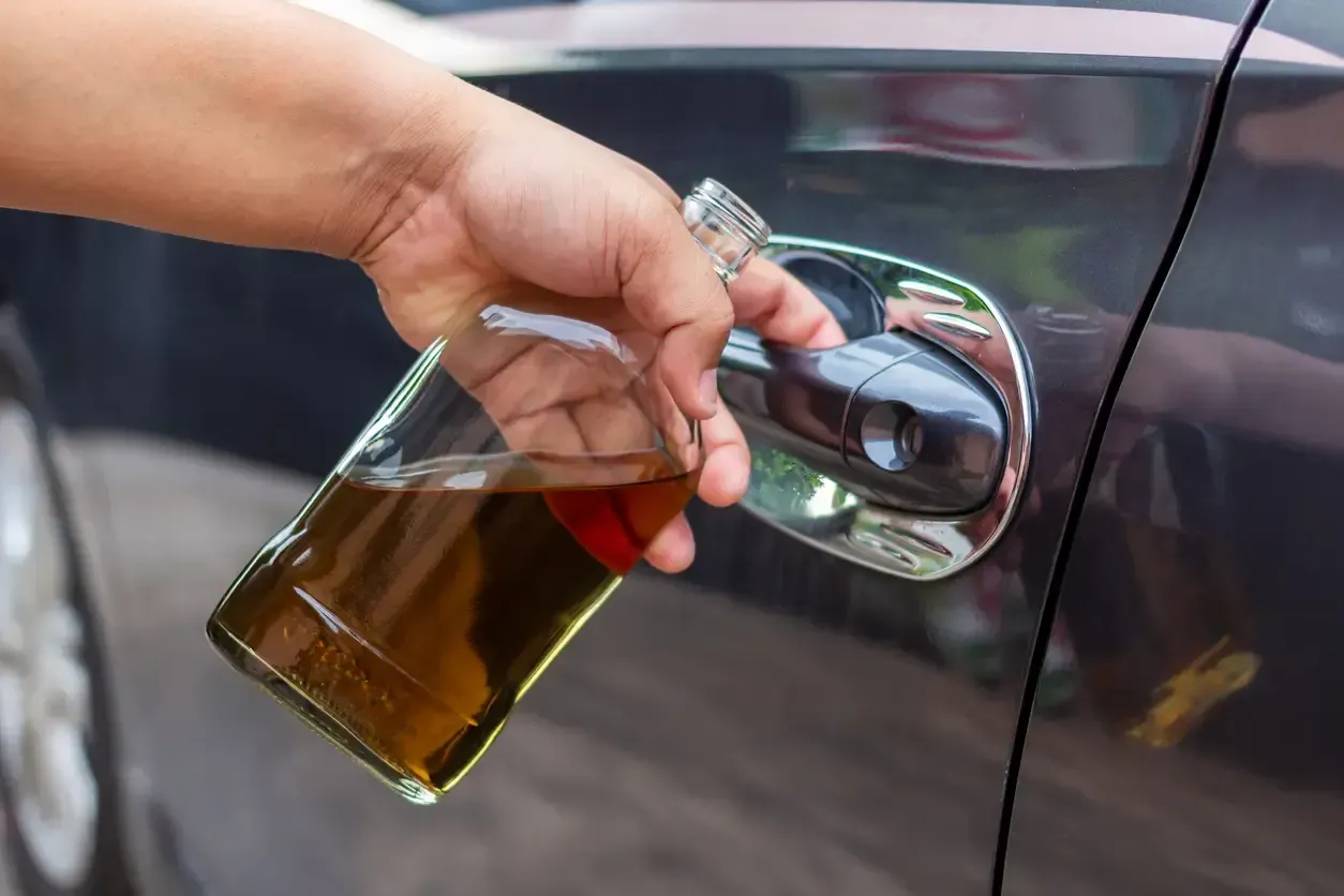 Man preparing to drive while drunk