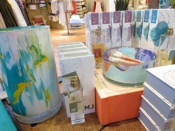 A display of candles and bowls in a store.