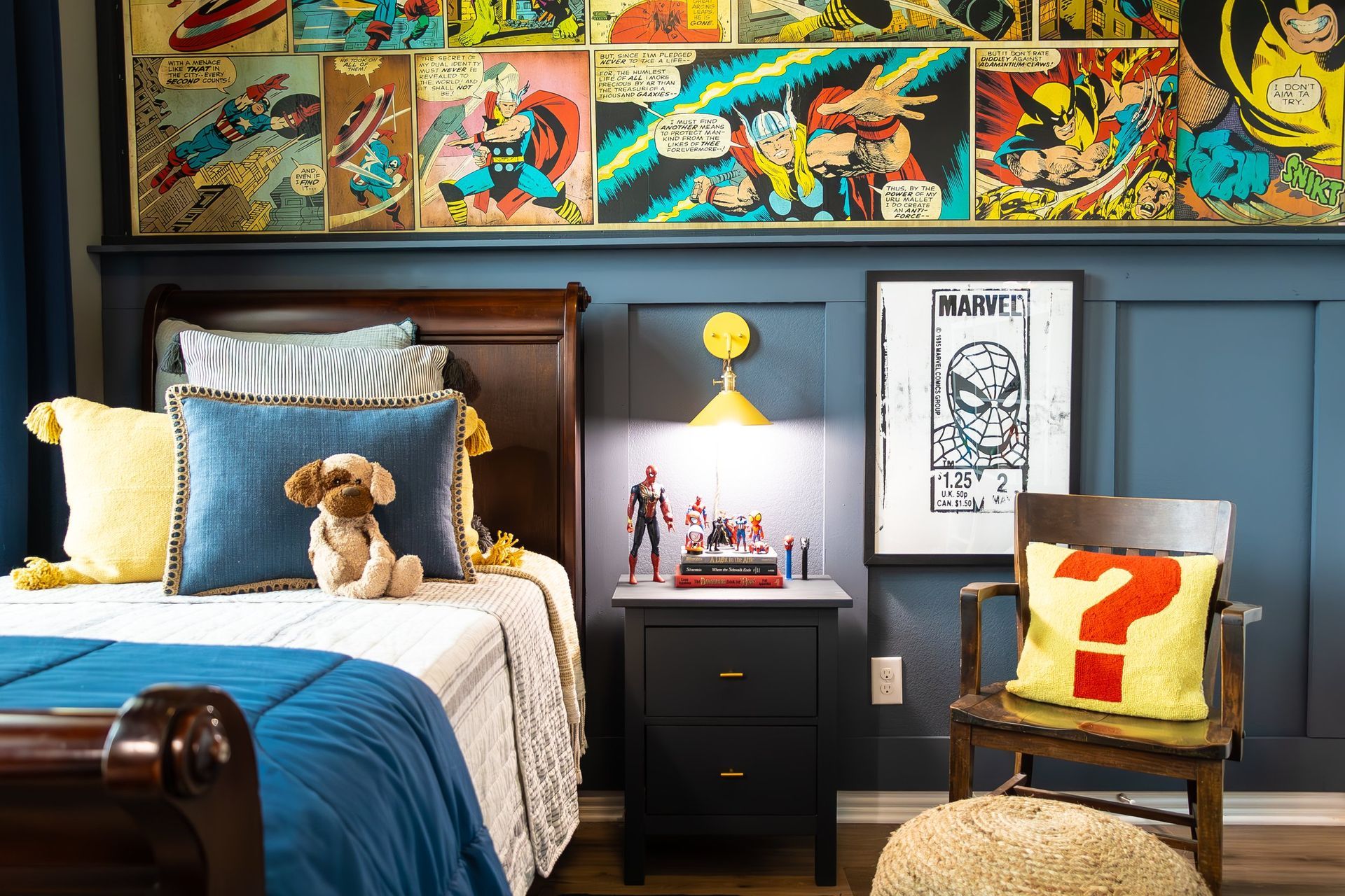 A bedroom with a bed , nightstand , chair and a wall covered in comic books.