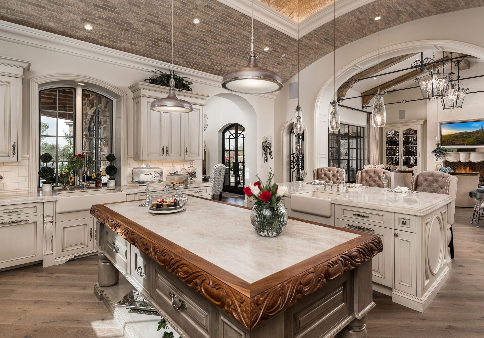 A living room with a couch , table , chairs and a fish tank.