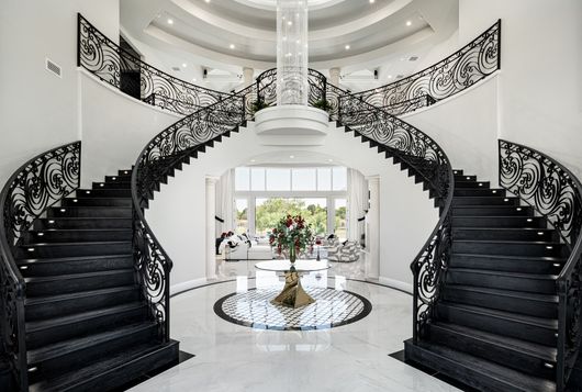 There is a large spiral staircase in the middle of the room.