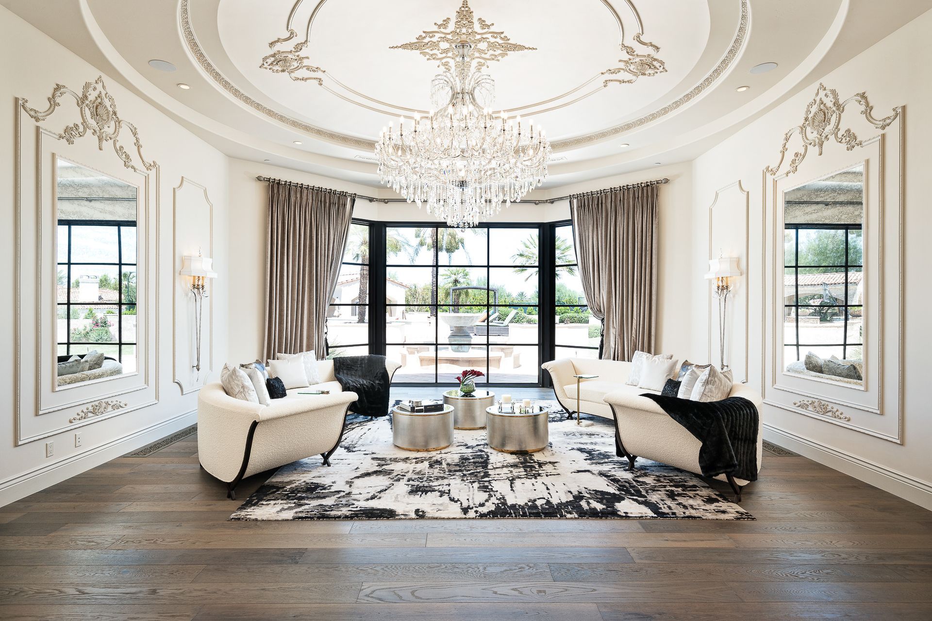 luxury living room with custom ceiling and chandelier